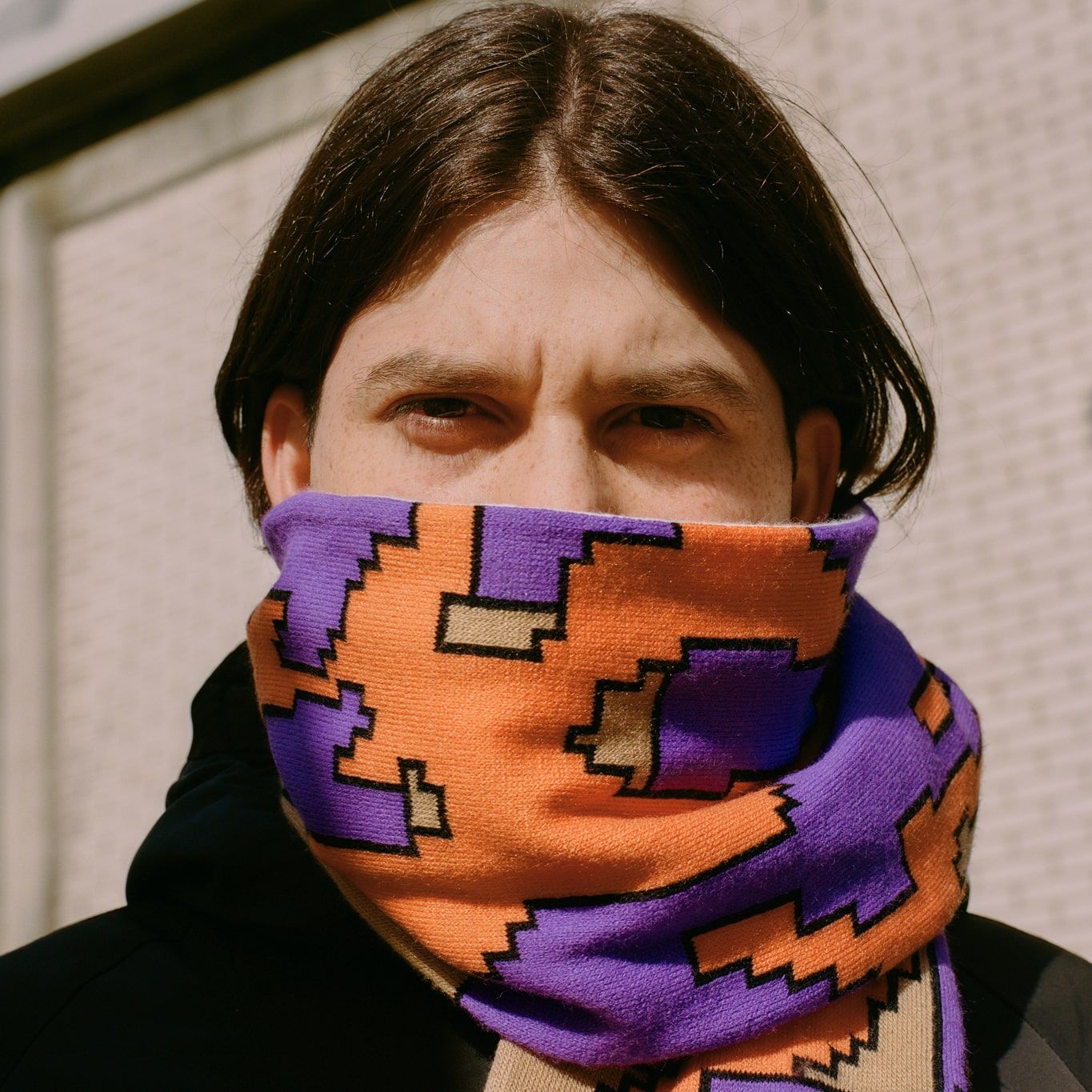 Man with a scarf around his neck